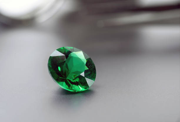 istock raw emeralds, gemstone jewelry on black background 1411397898