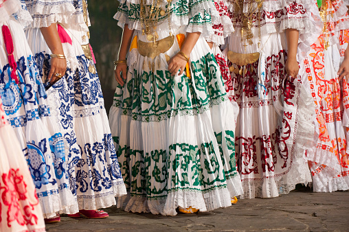 Detail of  women wearing traditional panamanian dress the pollera, Panama city, Panama, Central America