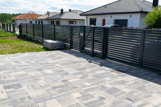 istock A modern panel fence in anthracite color, a visible sliding gate to the garage and a wicket with a letterbox. 1411398151