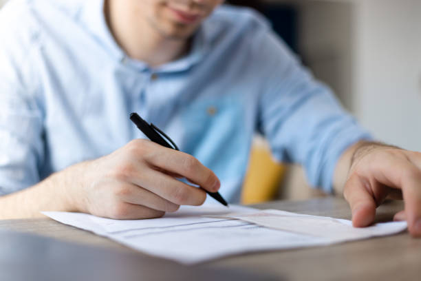 istock Man signing contract. Close up. Deal concept 1411399559