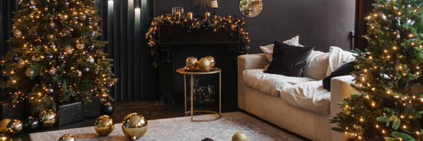 istock Christmas interior with a beautiful Christmas tree, sofa, light bulbs and dark background. 1411401893