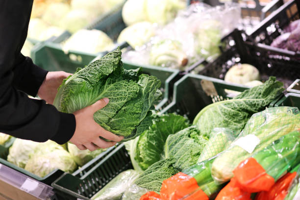 istock buying cabbage  at the market 1411404094