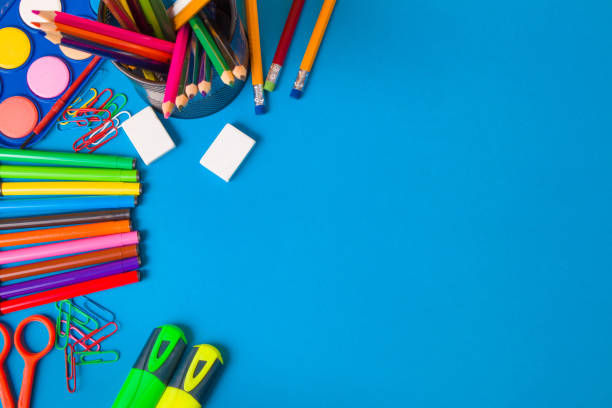 istock School Stationery items on blue background 1411404112