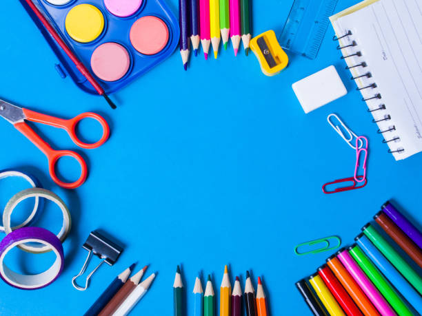 istock School Stationery items on blue background 1411404309