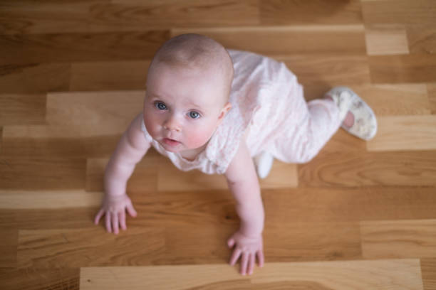 istock seven months old caucasian baby on the floor 1411406371