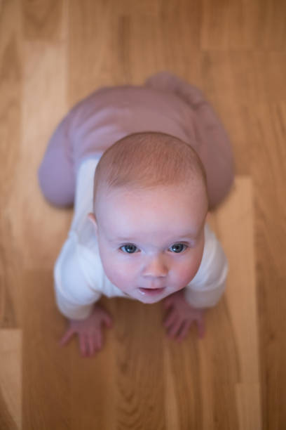 istock seven months old caucasian baby on the floor 1411406396