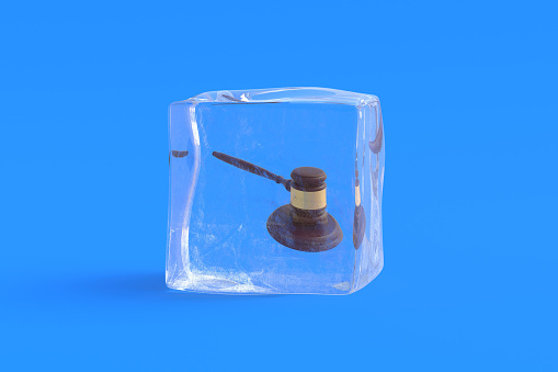 Judge gavel in ice cube. 3d illustration