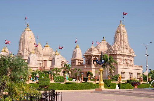 Carved temples at Nilkanthdham, an extensive religious complex with pagodas, fountains, statues & carved idols and gates, located at Poicha, Gujarat, India