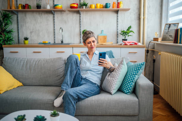 istock Mature woman relaxing at home 1411407941