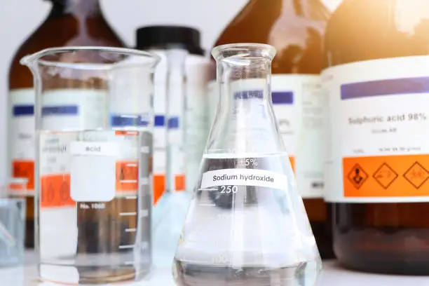 Photo of Sodium hydroxide in glass, chemical in the laboratory