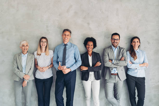 istock Business team standing against a wall 1411410518