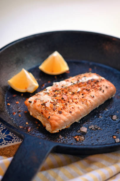istock Salmon Fillet Steak In A Pan With Lemon Slices 1411410591