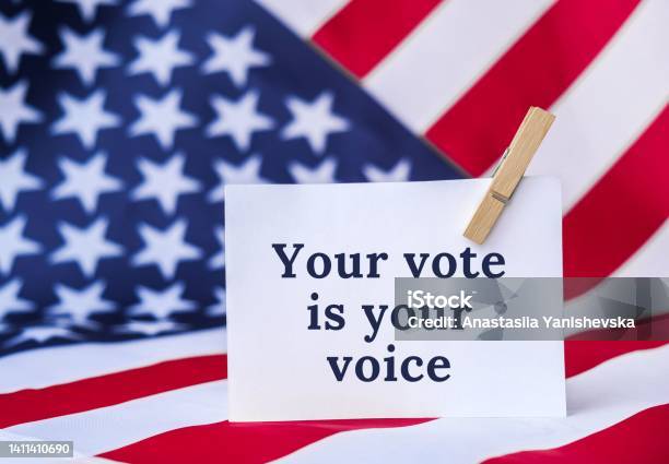The National Flag Of The United States Of America American Flag With Paper Note Message Text Election Day Give Vote Your Vote Matters Counts Vote Is Voice Be Responsible Voting Government Stock Photo - Download Image Now