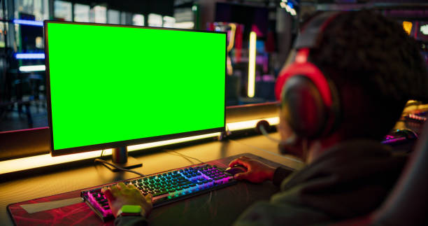 green screen display pro gaming championship setup with steering wheel. esport gamer boy - racing game imagens e fotografias de stock