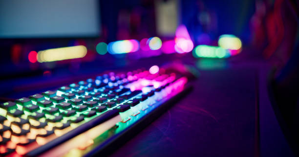 istock Pro gamer team computer setup at video game eSport championship with neon keyboard 1411413614