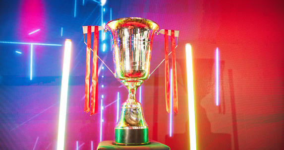 Esport championship trophy on a stage. Pro video game championship event.