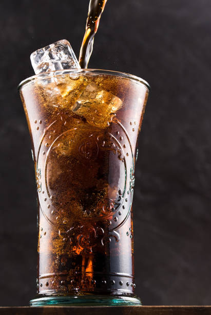 istock Refreshing cola drink in a glass with ice 1411414994
