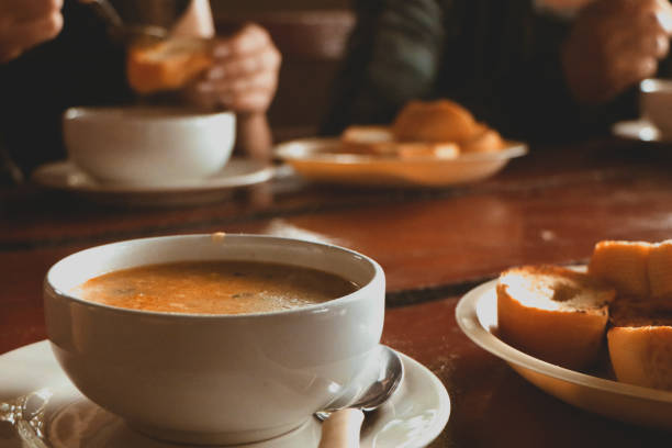 table served with soup bowl and breads