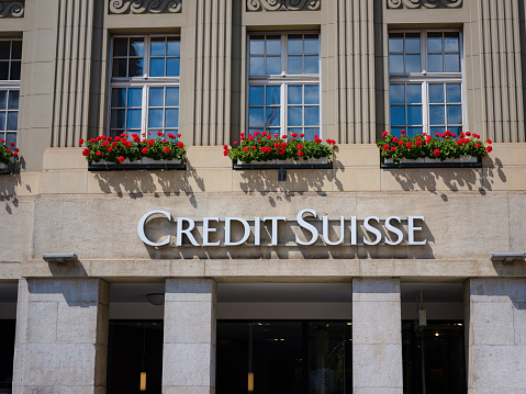 Bern, Switzerland - July 4 2022: Logo of Swiss bank Credit Suisse at entrance of office building at Bern. Credit Suisse Real Estate Fund LivingPlus Credit Suisse is second-largest Swiss bank.