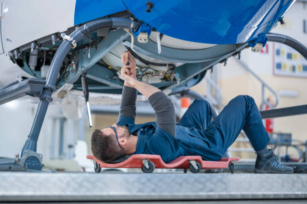 istock Mechanic repairing helicopter engine 1411417391