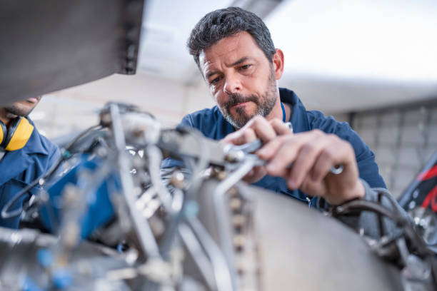 istock Mechanic repairing helicopter engine 1411417393