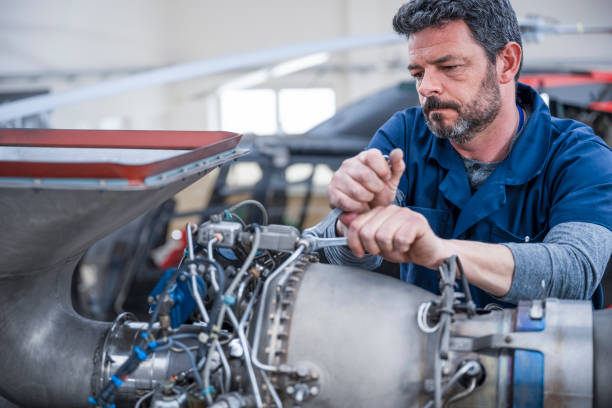 istock Mechanic repairing helicopter engine 1411417402