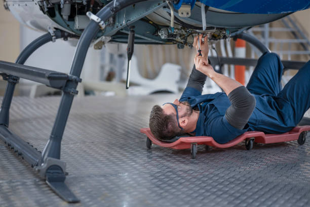 istock Mechanic repairing helicopter engine 1411417403