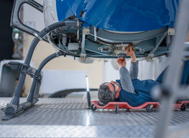 istock Mechanic repairing helicopter engine 1411417411