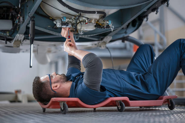 istock Mechanic repairing helicopter engine 1411417425