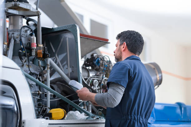 istock Male mechanic checking helicopter 1411417432