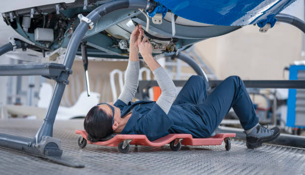 istock Female mechanic repairing helicopter engine 1411417434