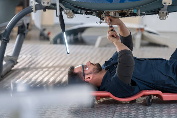 istock Mechanic repairing helicopter engine 1411417463