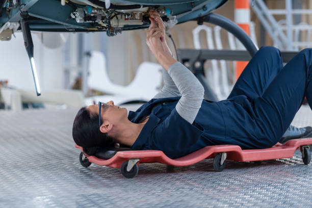 istock Female mechanic repairing helicopter engine 1411417465