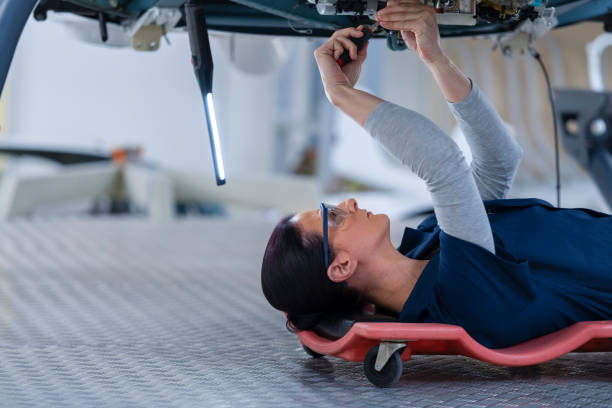 istock Female mechanic repairing helicopter engine 1411417467