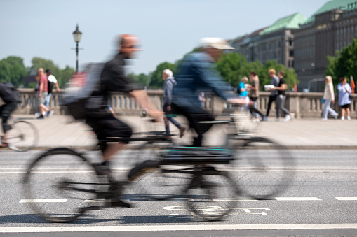 long exposure of cyclists on a bike lane