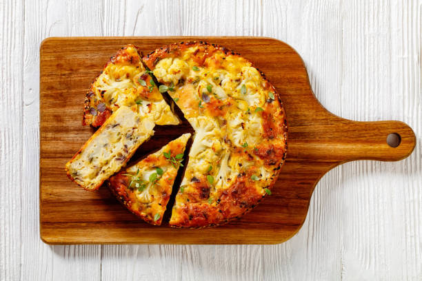 istock Cauliflower Cake with cheese, basil, top view 1411417958