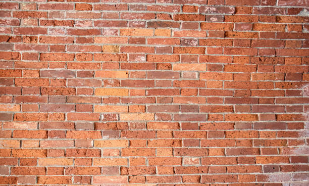 istock red old brick wall with gray cement joints 1411419044