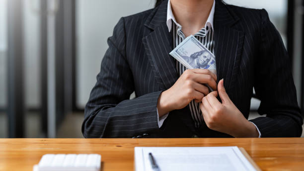 istock Business people giving bribe and collaborating with corruption. Bribery and corruption concept. 1411420095