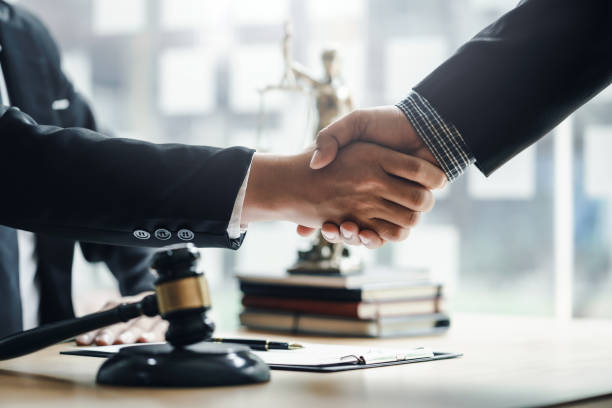 Businessman handshake partner lawyers or attorneys discussing a contract agreement. Business people shaking hands to congratulate success. Businessman handshake partner lawyers or attorneys discussing a contract agreement. Business people shaking hands to congratulate success. together for yes stock pictures, royalty-free photos & images