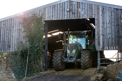 Image of Tractor with a cattle trailer at the farm