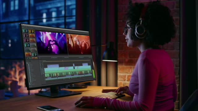 Professional Black Female Videographer Working on Desktop Computer, Editing Music Video Clip, Movie Scenes with Audio in Home Office. Creative Brazilian Artist Cutting Stylish Social Media Content
