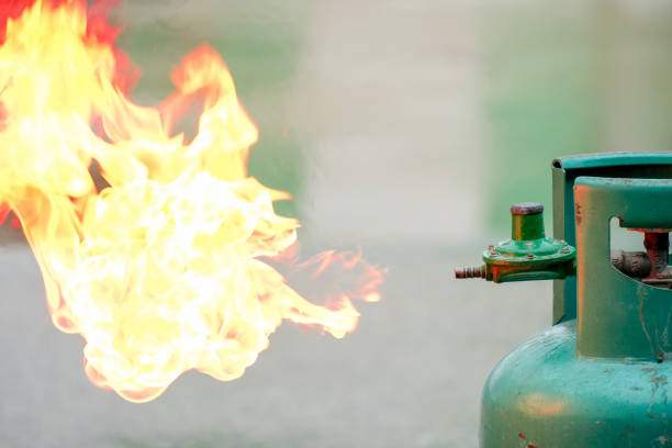 fire emanating from a green gas tank, security daily life concept