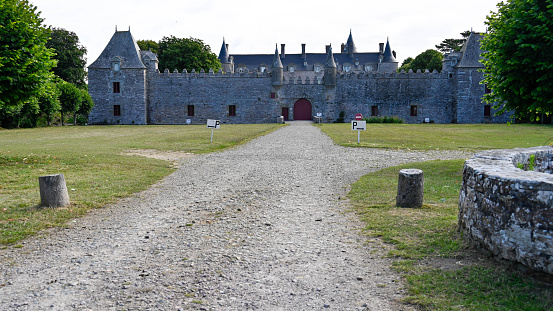 Crathie - United Kingdom. May 26, 2023: The elegant Balmoral Castle, with its ornate stonework and iconic towers, is captured here against the serene Scottish landscape