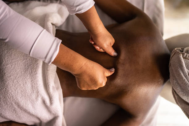 istock Woman getting a message in a spa 1411425210