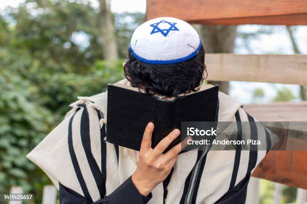 Frontal View Of A Jew Praying To His God And Curving His Face With A Siddur Stock Photo - Download Image Now