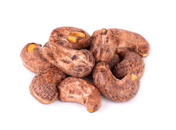 istock Cashew nuts in shell isolated on white background. Roasted and salted cashew nuts. 1411427004