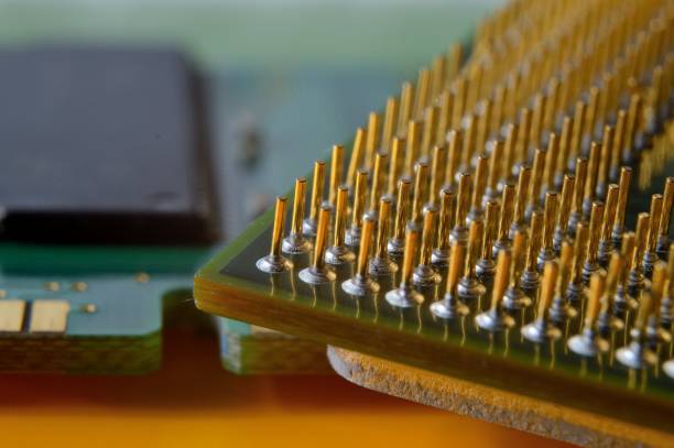 istock microprocessor on the background of the microcircuit of the motherboard. 1411429648