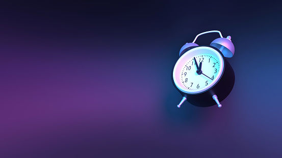 Back to School concept with a classical black alarm clock on vaporwave blue and purple background. Educational concept with copy space. Easy to crop for all your design and print needs.