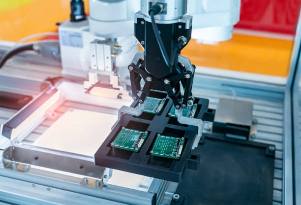 istock automatic robot for print circuit board (PCB)assembly machine during soldering or welding part 1411430786
