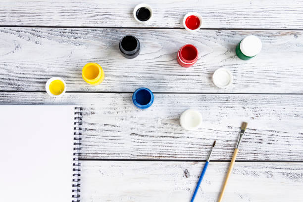 istock Office supplies for work, sales and study on a wooden background. 1411431603